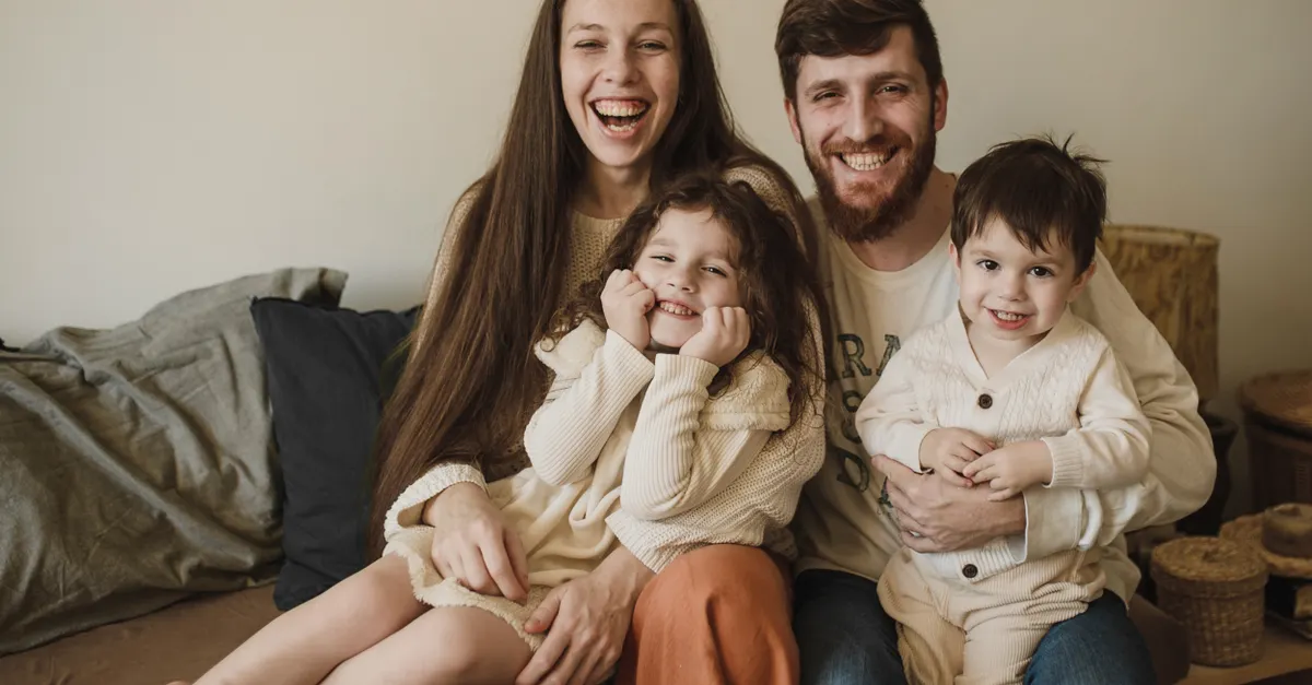 Family relaxing on a couch at home in Tampa