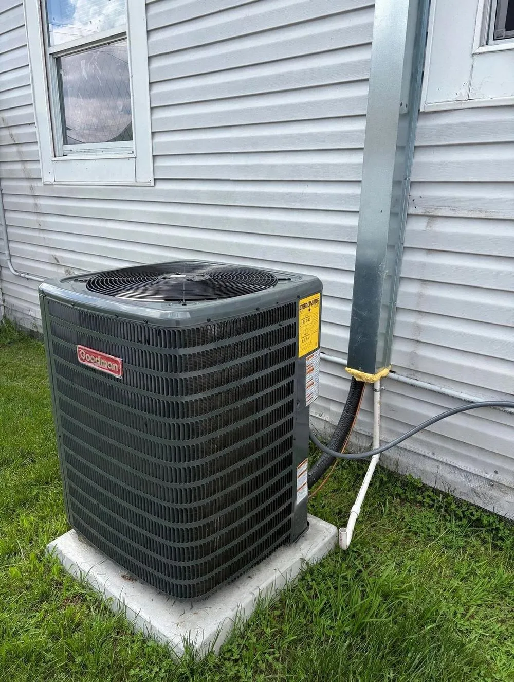 Mendoza technician servicing an air conditioner at a Palm Harbor home