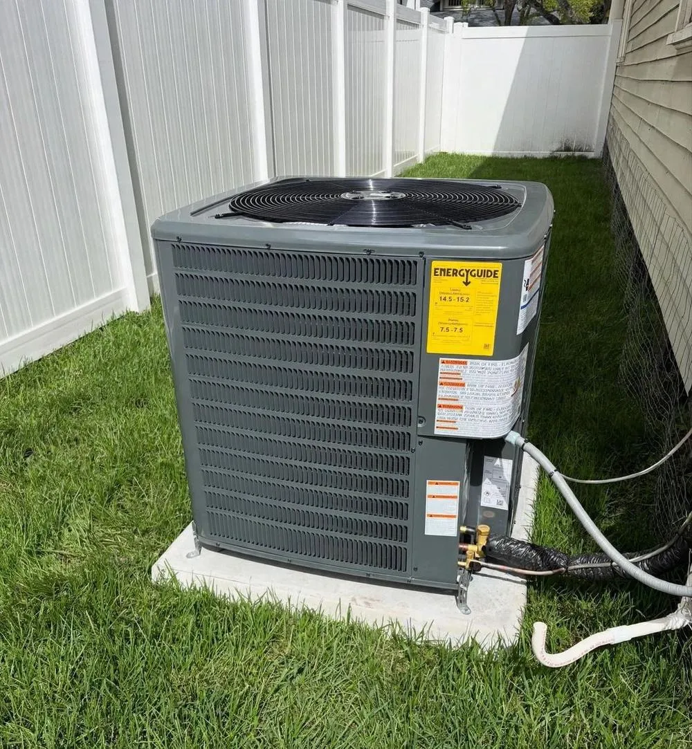Mendoza technician finishing an AC repair at a home in Oldsmar, FL