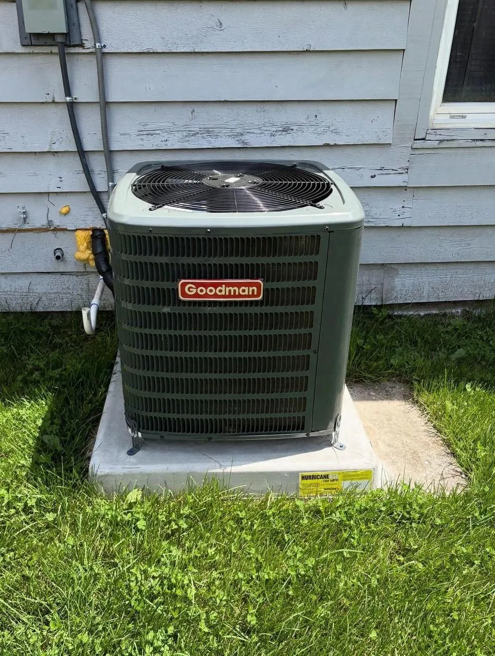 Mendoza Heating and Air technician at work on an AC repair in St. Petersburg, FL