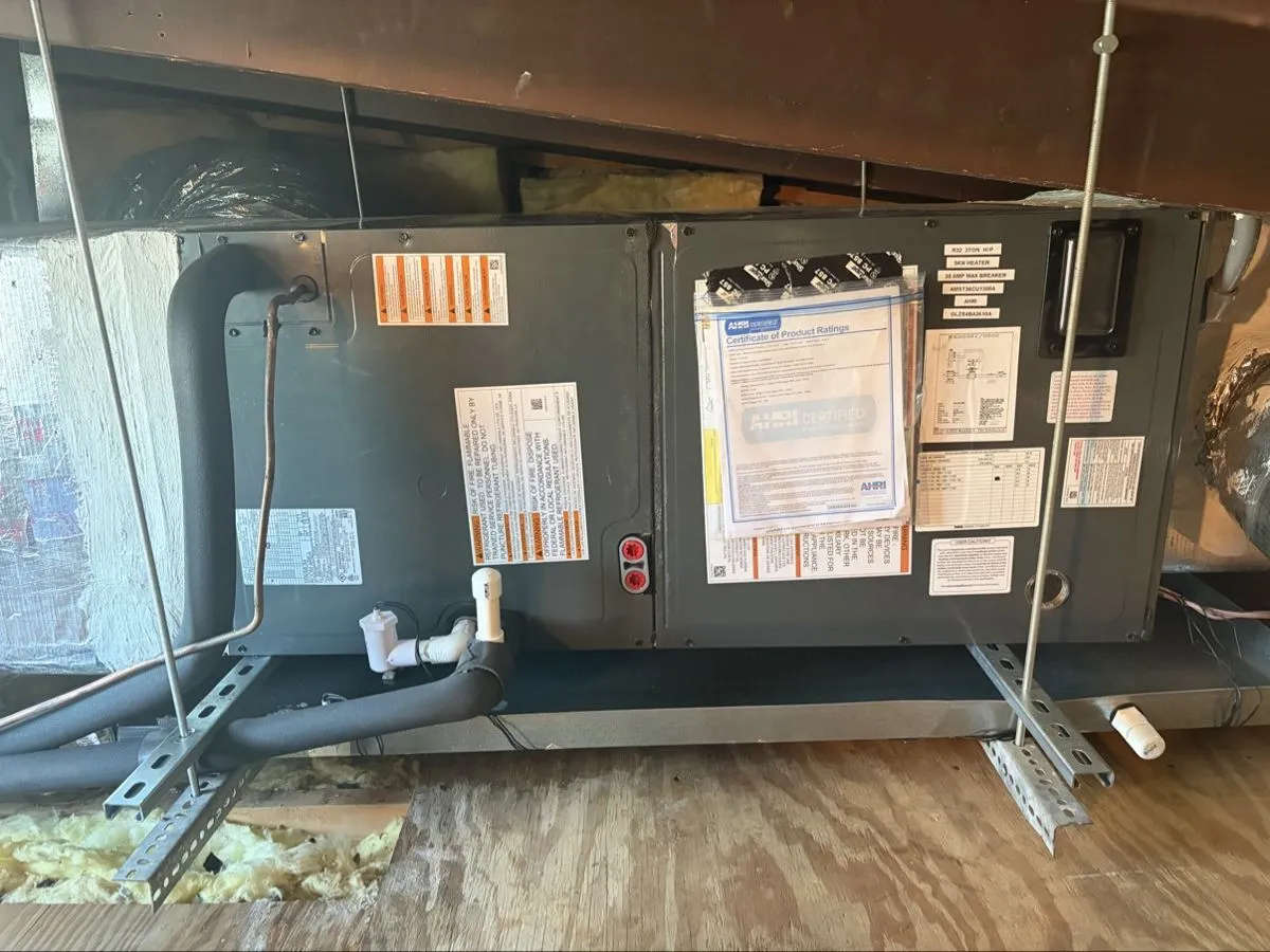 wil, owner of Mendoza Heating and Air, with a new condenser in Northdale, FL
