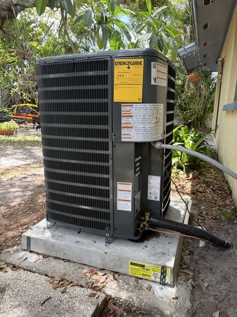 New condenser installed on a hurricane pad by Mendoza Heating and Air
